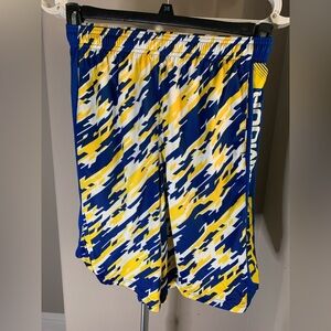 Youth Large Under Armour basketball shorts in blue and yellow color.